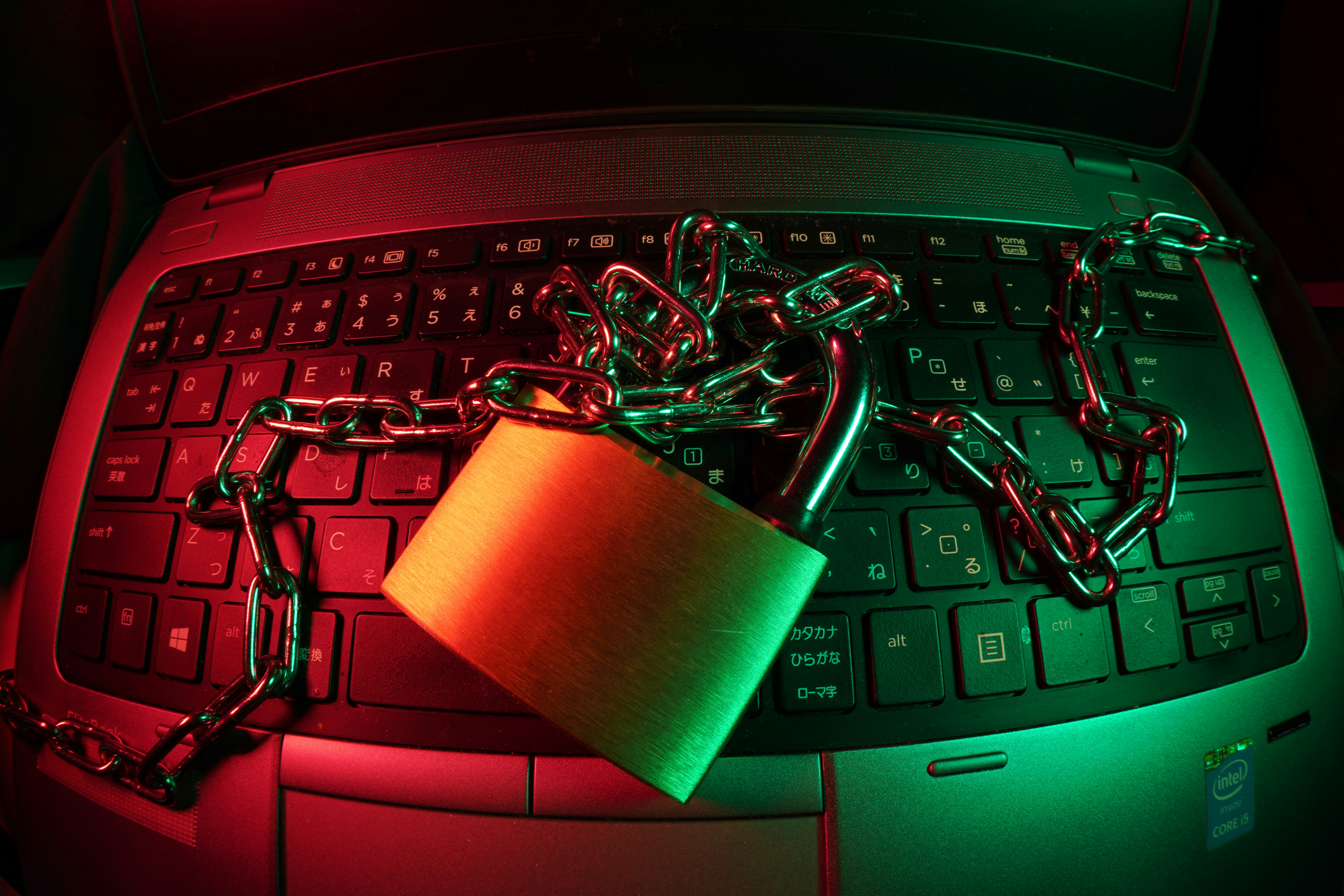 Padlock and chain securing a laptop